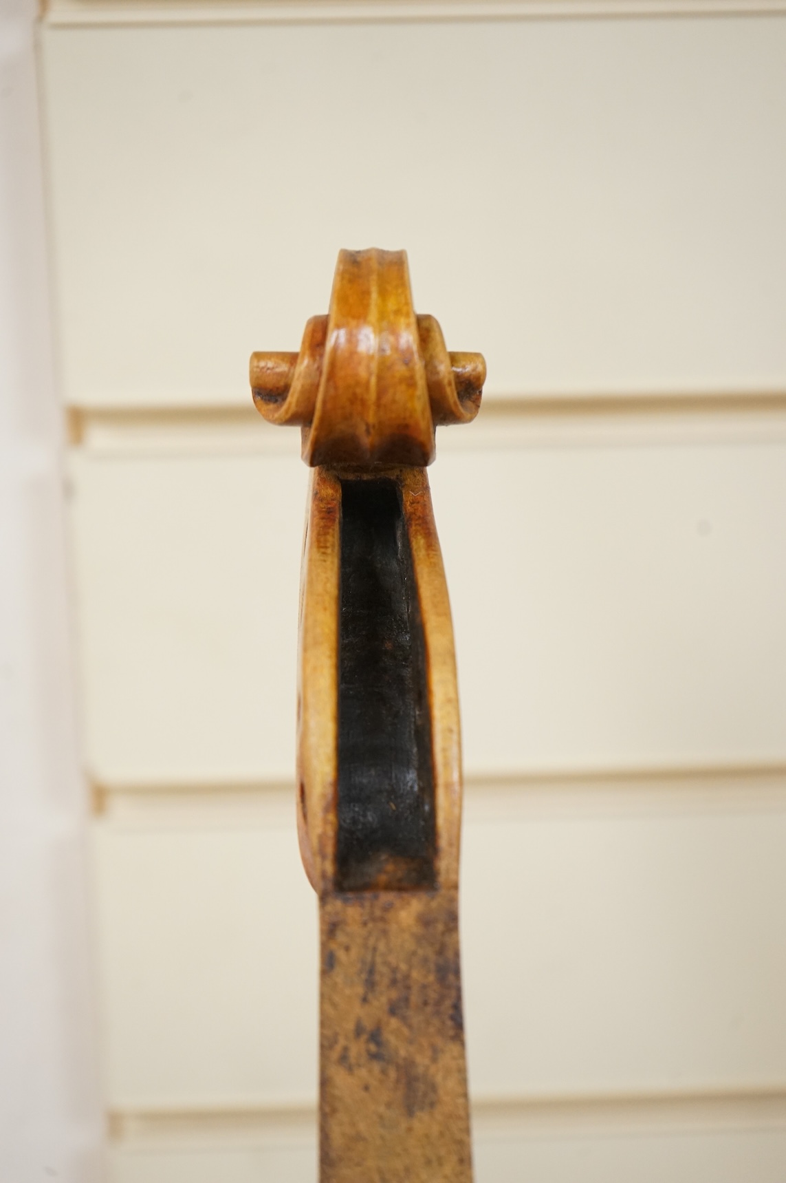 Three violins; a late 19th century German Stradivarius pattern violin, without label, a handmade violin (a.f.), with sound post crack, broken and repaired scroll, etc. and a Maidstone violin body, varnish stripped from t